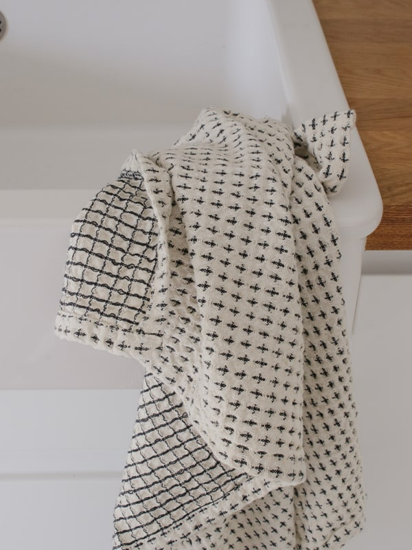 Torchon à vaisselle de qualité 100% coton gaufré, blanc et noir.