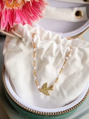 Bracelet oiseau doré, chaine et perles blanches